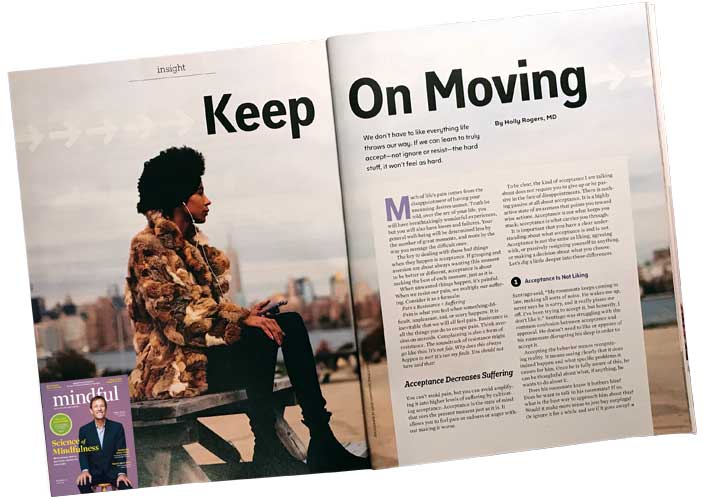Pcture of magazine spread with a young dark skinned woman and words "Keep on Moving".
